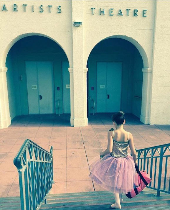 Kyne Dance Academy ballet student going down the stairs to a performance